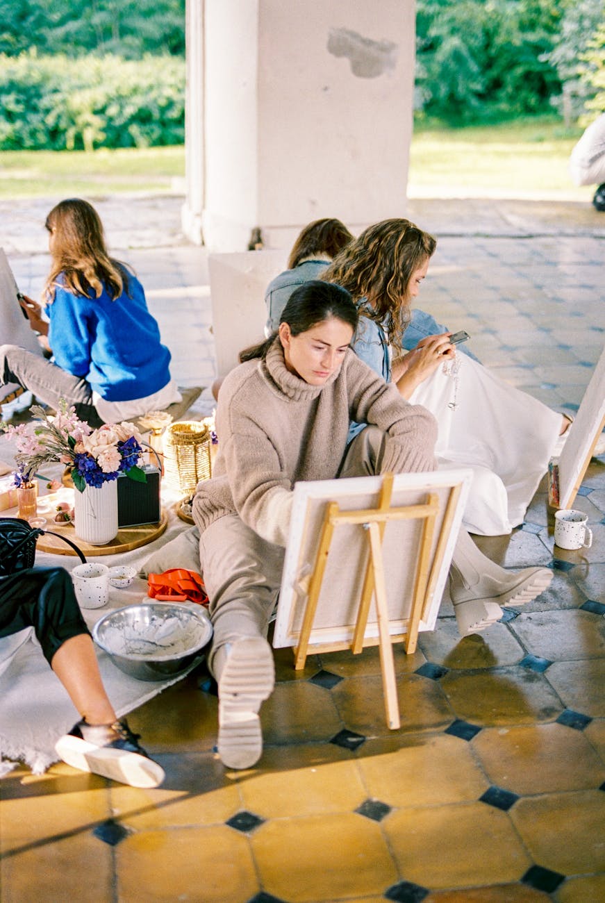 people painting on canvas