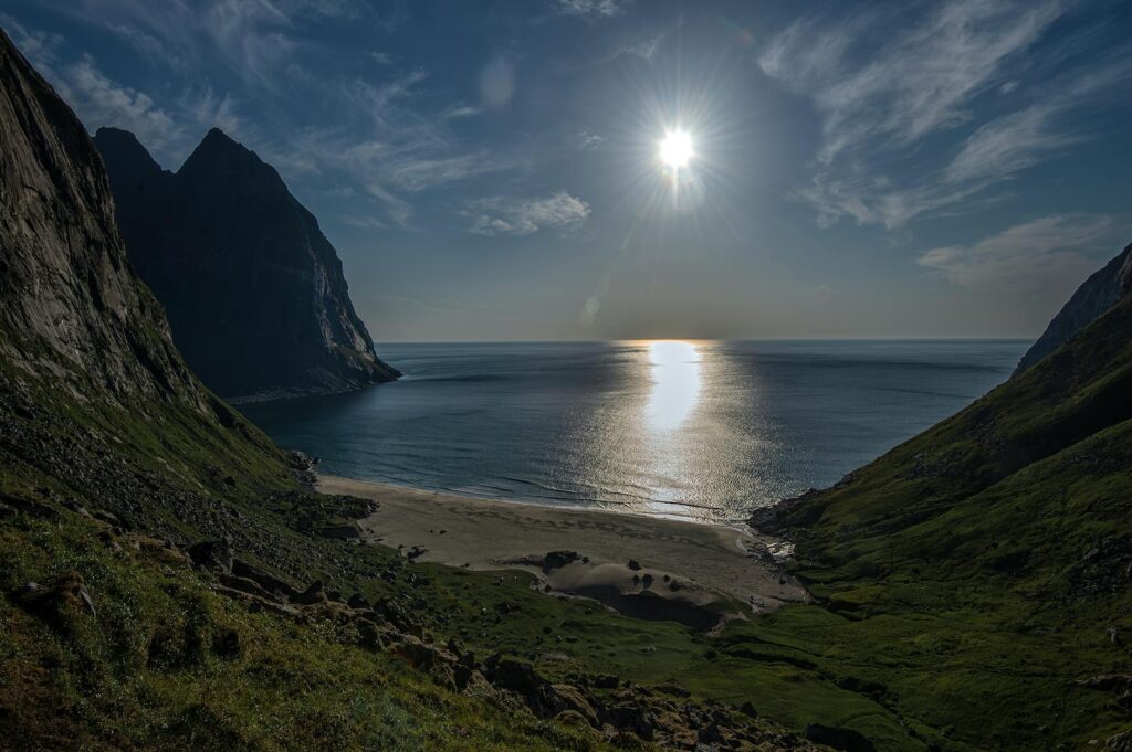 serene beach at lofoten islands with sunlit ocean